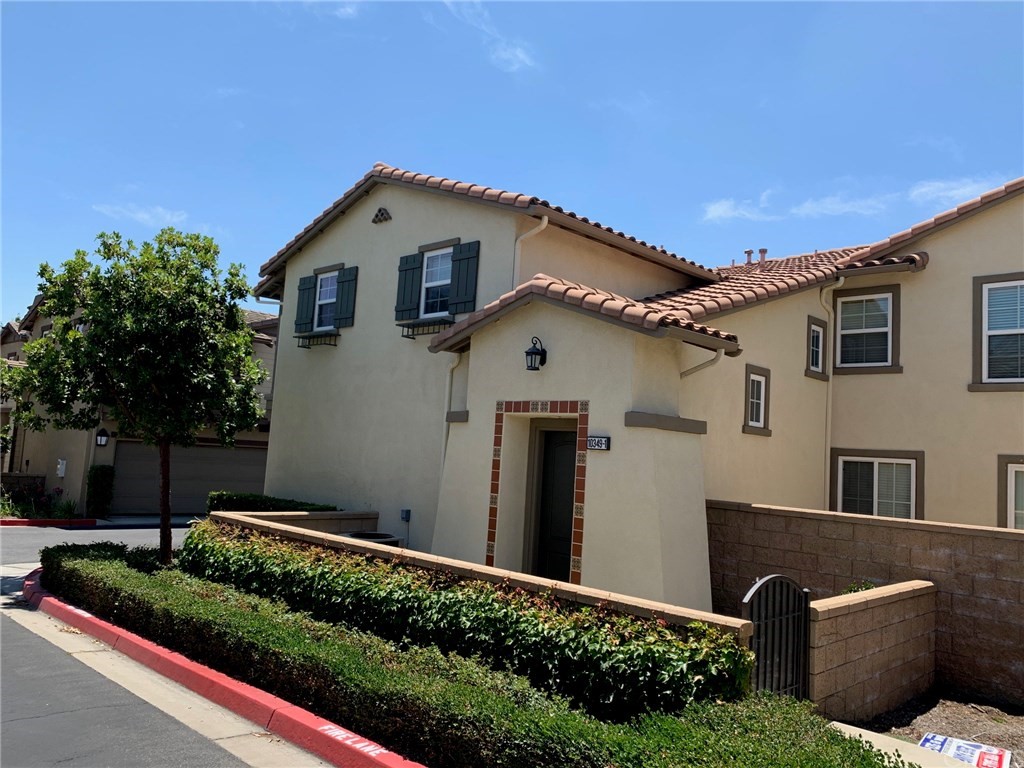 10349 Cooks Drive, Unit 1 Rancho Cucamonga, CA 91730 - Photo 1 of 1 a front view of a house with a yard