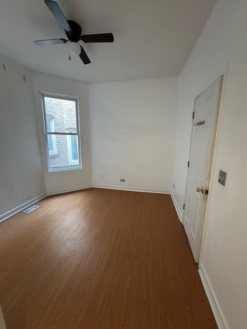 3145 West Augusta Boulevard, Unit 2 Chicago, IL 60622 - Photo 13 of 29 an empty room with a empty space and windows
