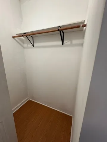 a kitchen with stainless steel appliances granite countertop a sink a stove a dining table and chairs