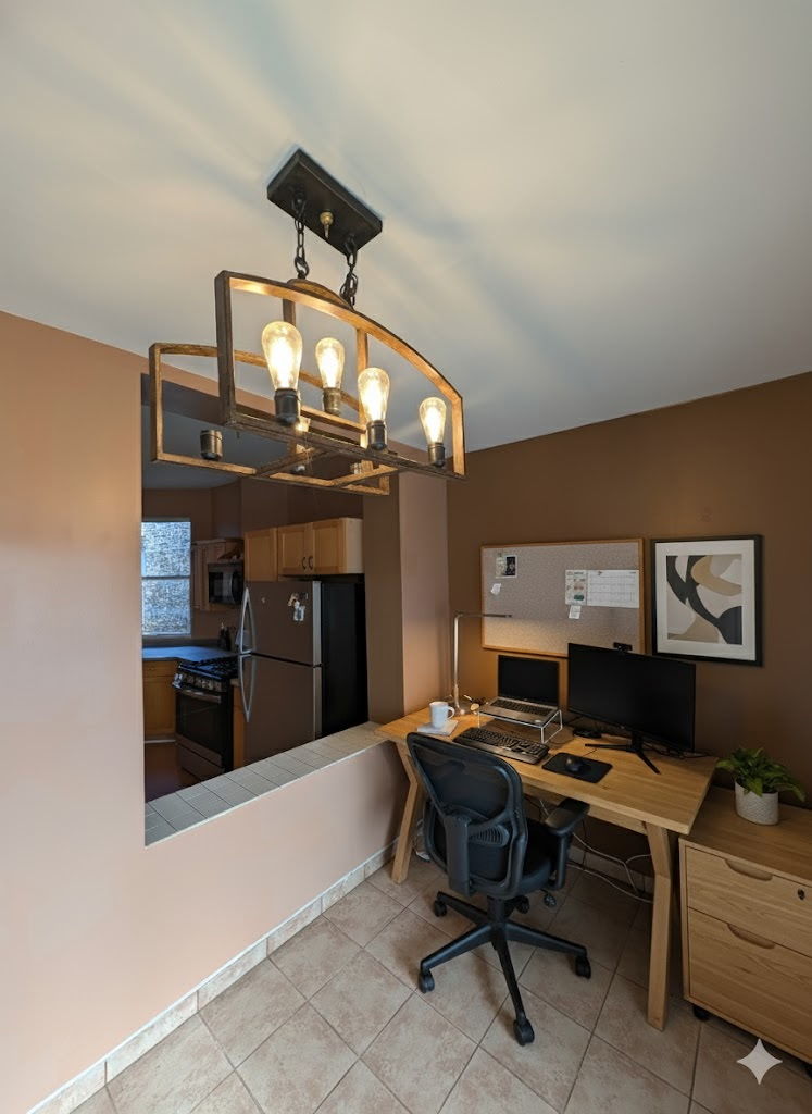 3145 West Augusta Boulevard, Unit 2 Chicago, IL 60622 - Photo 22 of 29 a livingroom with dining area a flat screen tv and a clock