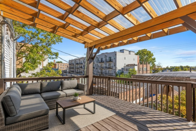 3145 West Augusta Boulevard, Unit 2 Chicago, IL 60622 - Photo 25 of 29 a view of a couches on the roof deck
