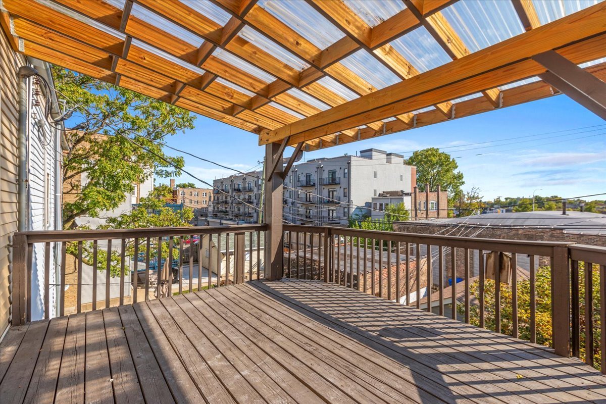 3145 West Augusta Boulevard, Unit 2 Chicago, IL 60622 - Photo 26 of 29 a view of a balcony with wooden floor