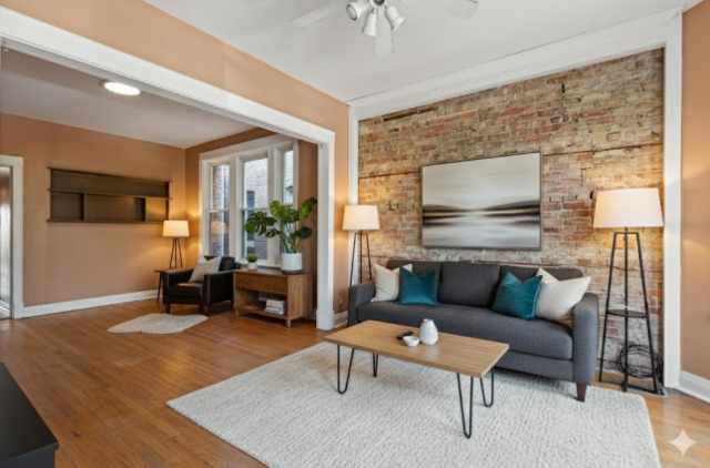 3145 West Augusta Boulevard, Unit 2 Chicago, IL 60622 - Photo 6 of 29 a living room with furniture and a flat screen tv