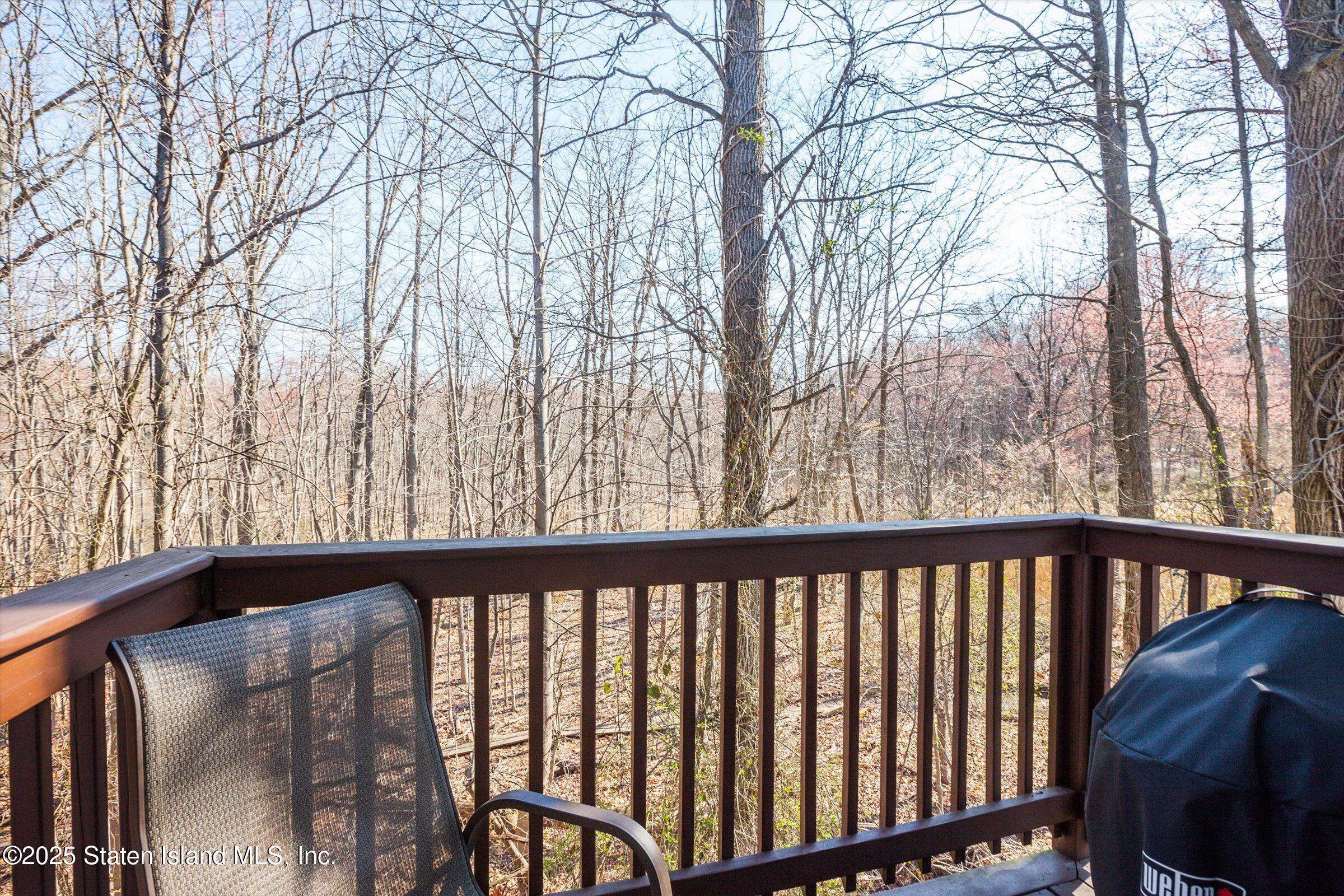 25 Gwenn Loop Staten Island, NY 10314 - Photo 11 of 32 a view of a balcony with trees