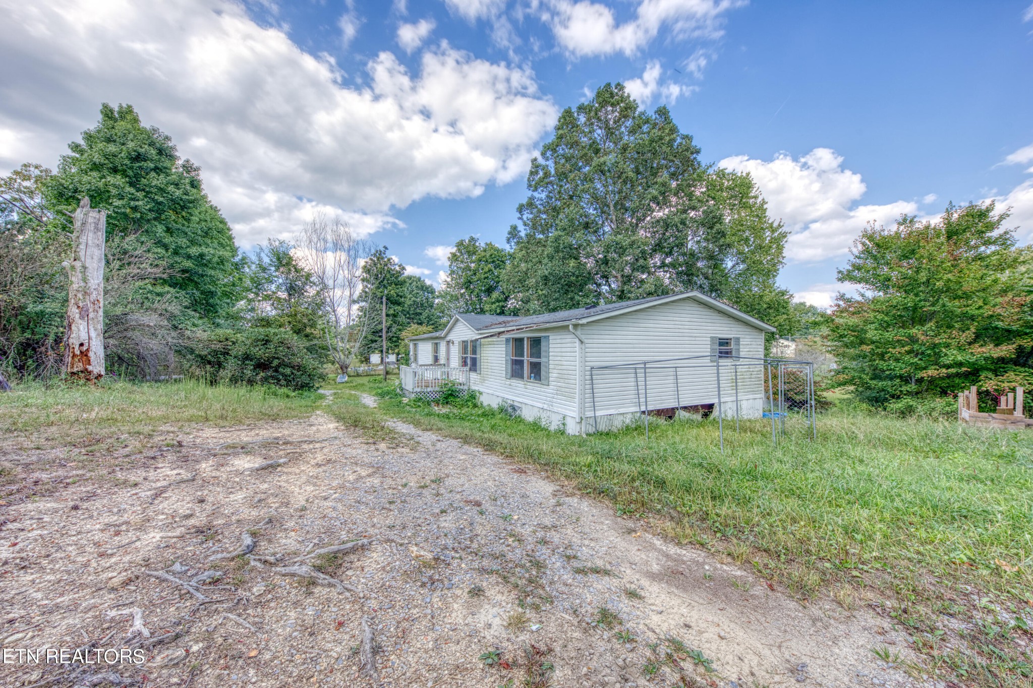 8504 Childress Road Powell, TN 37849 - Photo 3 of 15 a view of a house with yard and a garden
