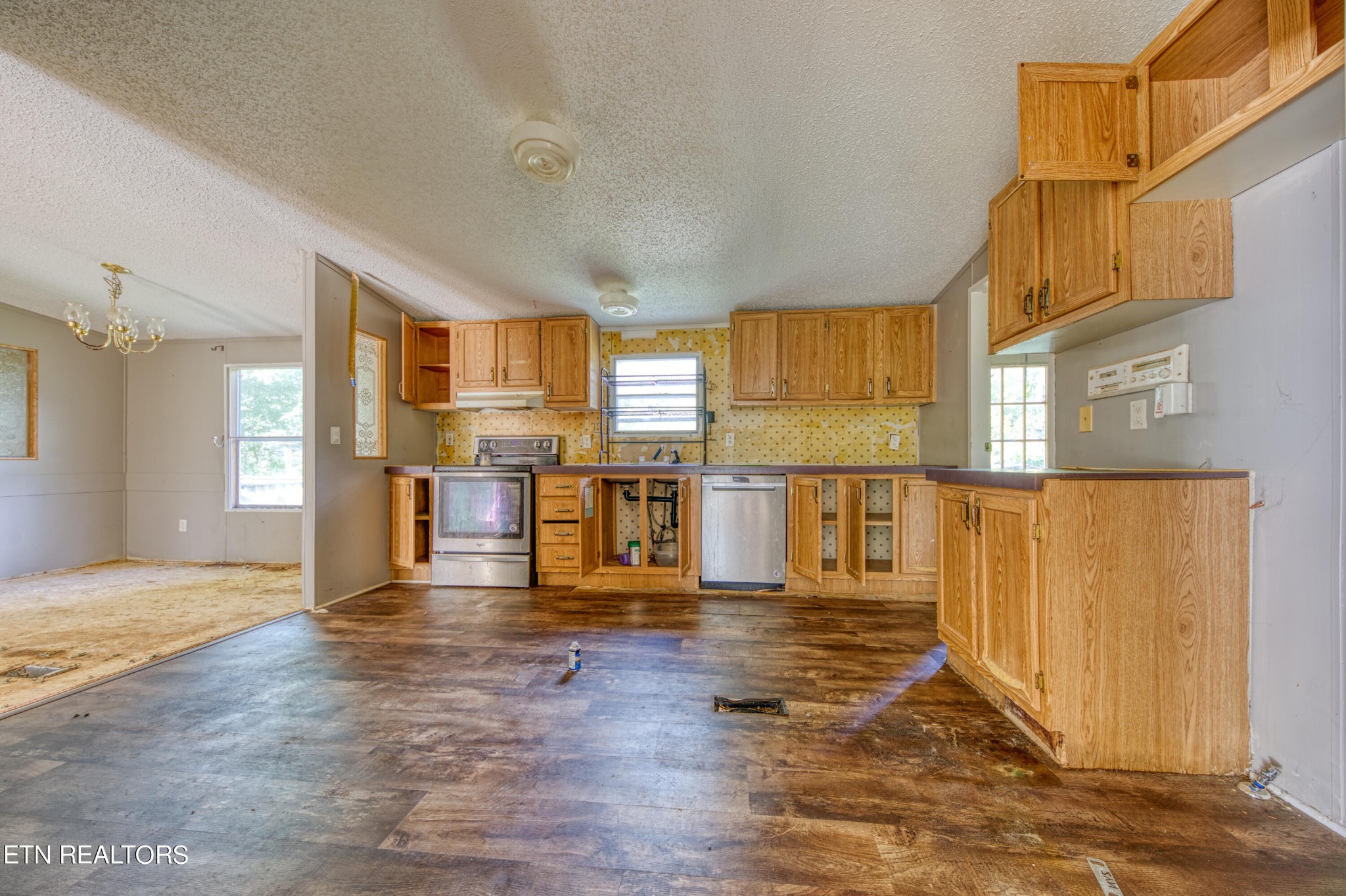 8504 Childress Road Powell, TN 37849 - Photo 9 of 15 a view of a kitchen with wooden floor and a window