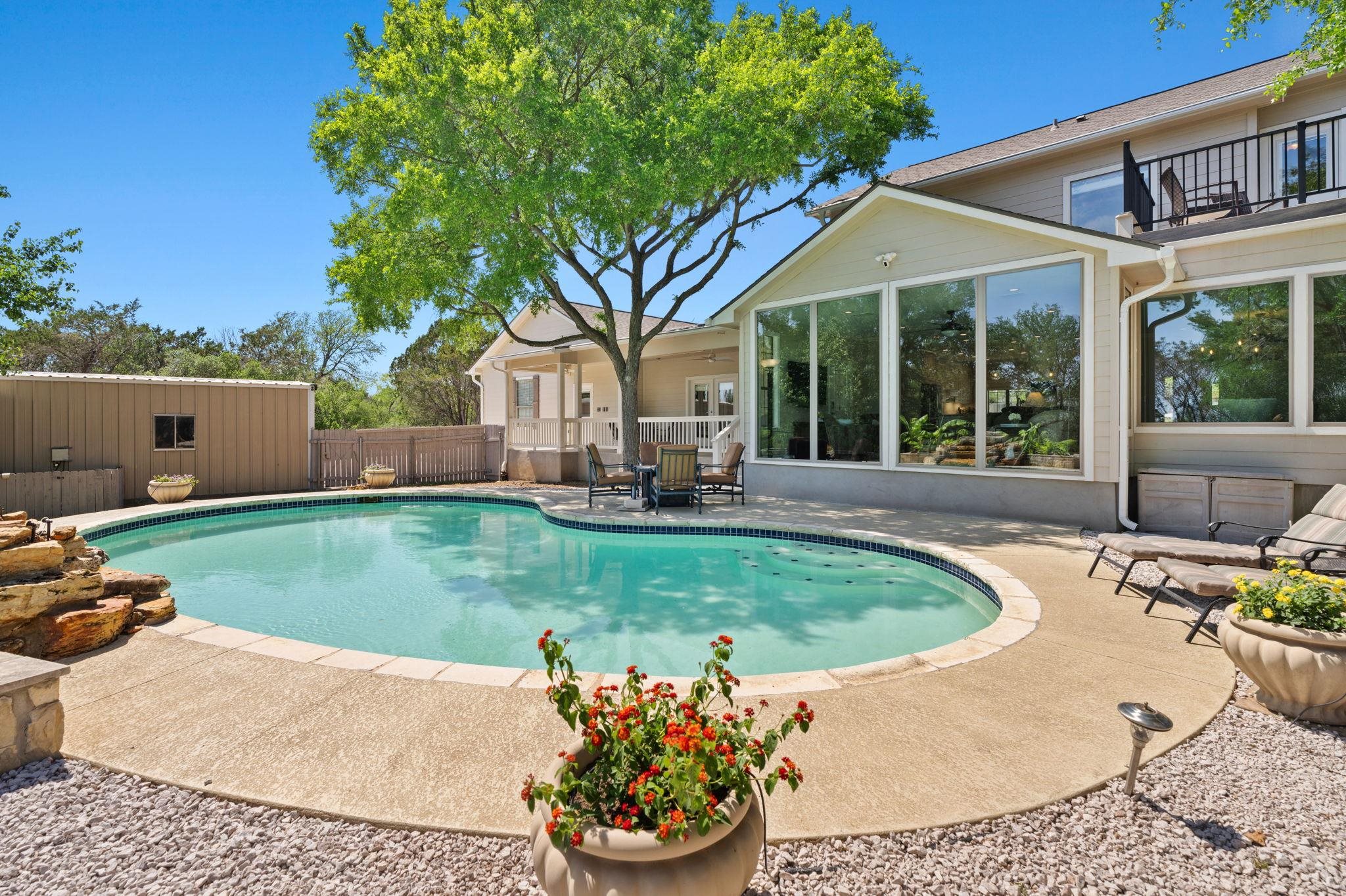 2409 Mormon Mill Road Marble Falls, TX 78654 - Photo 22 of 30 a front view of a house with a garden
