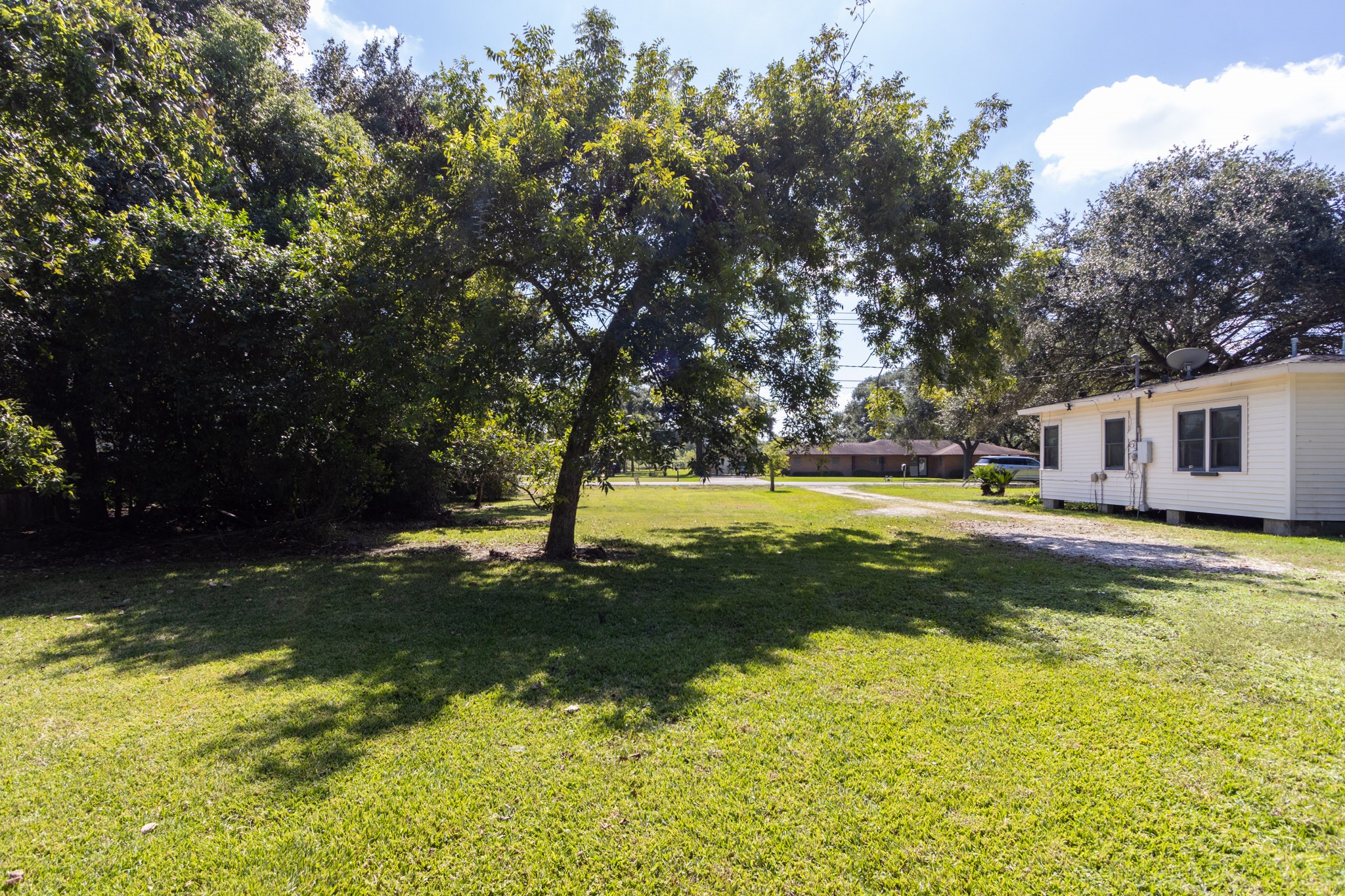 24-th 24th Street Santa Fe, TX 77510 - Photo 6 of 18 a view of a house with swimming pool and a yard