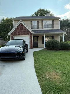 a view of a car in front of a house