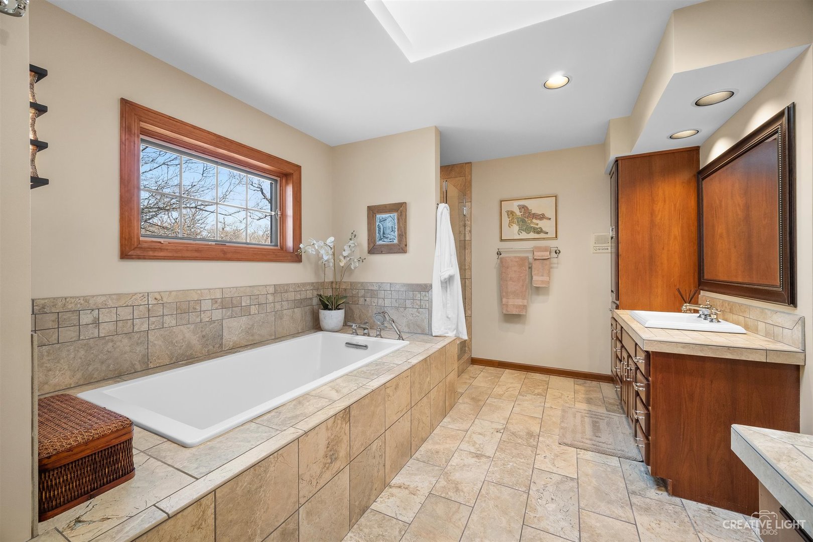 5S430 Deer Ridge Path Big Rock, IL 60511 - Photo 24 of 72 a bathroom with a tub sink and mirror