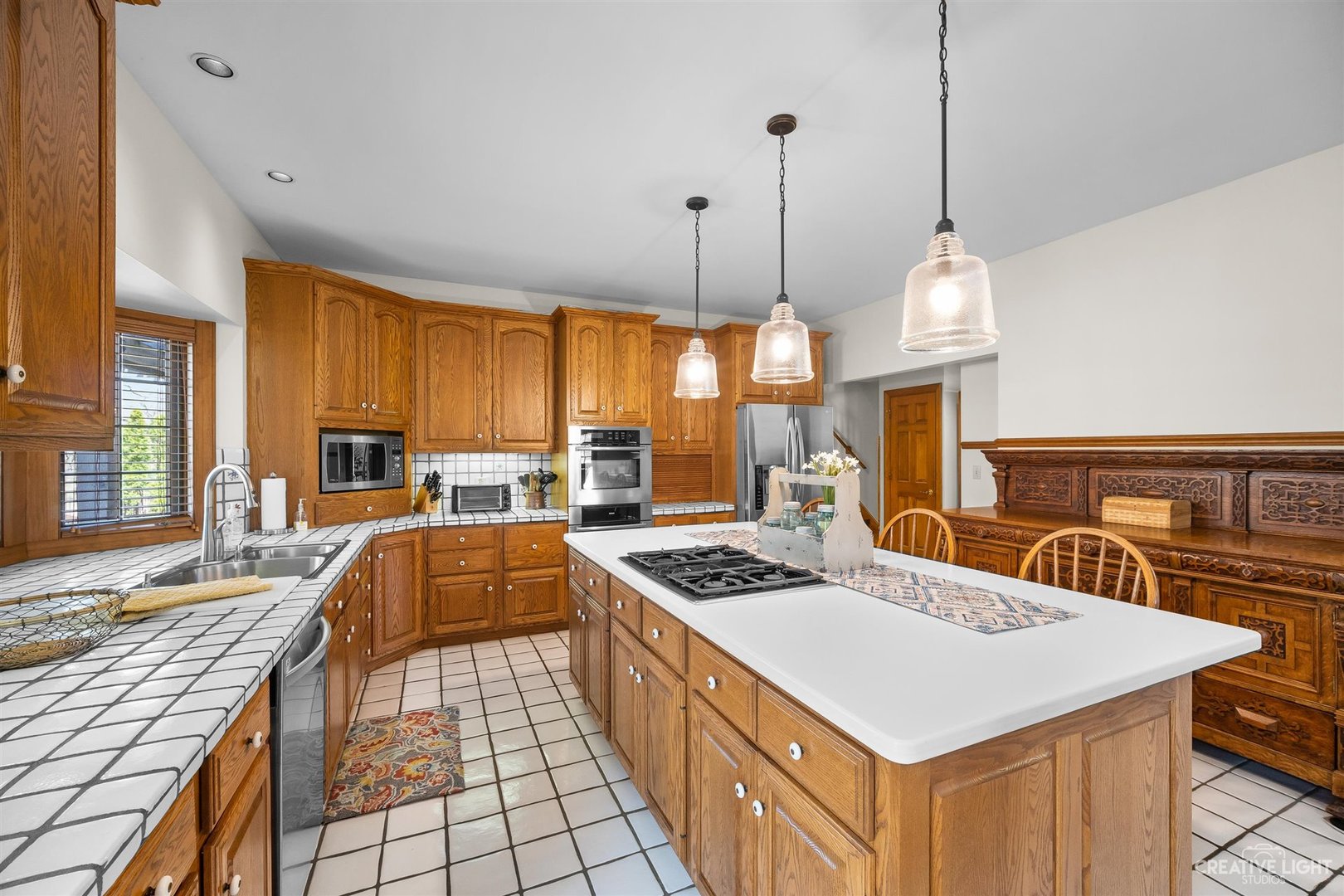 5S430 Deer Ridge Path Big Rock, IL 60511 - Photo 10 of 72 a kitchen that has a stove a table and chairs in it