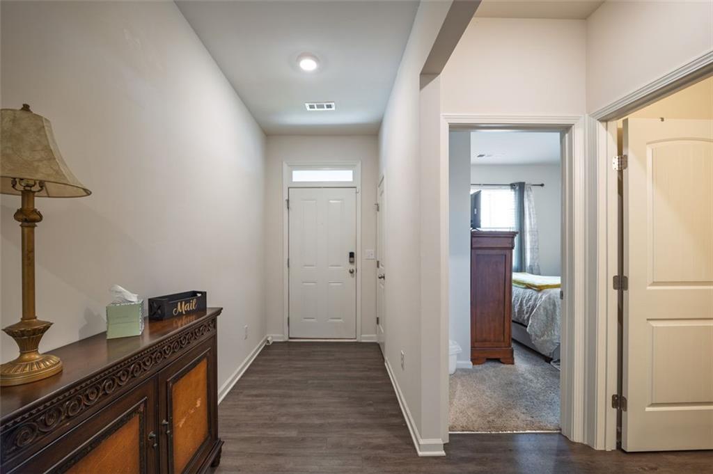 3841 Makeover Court Atlanta, GA 30349 - Photo 17 of 44 a view of a kitchen from the hallway
