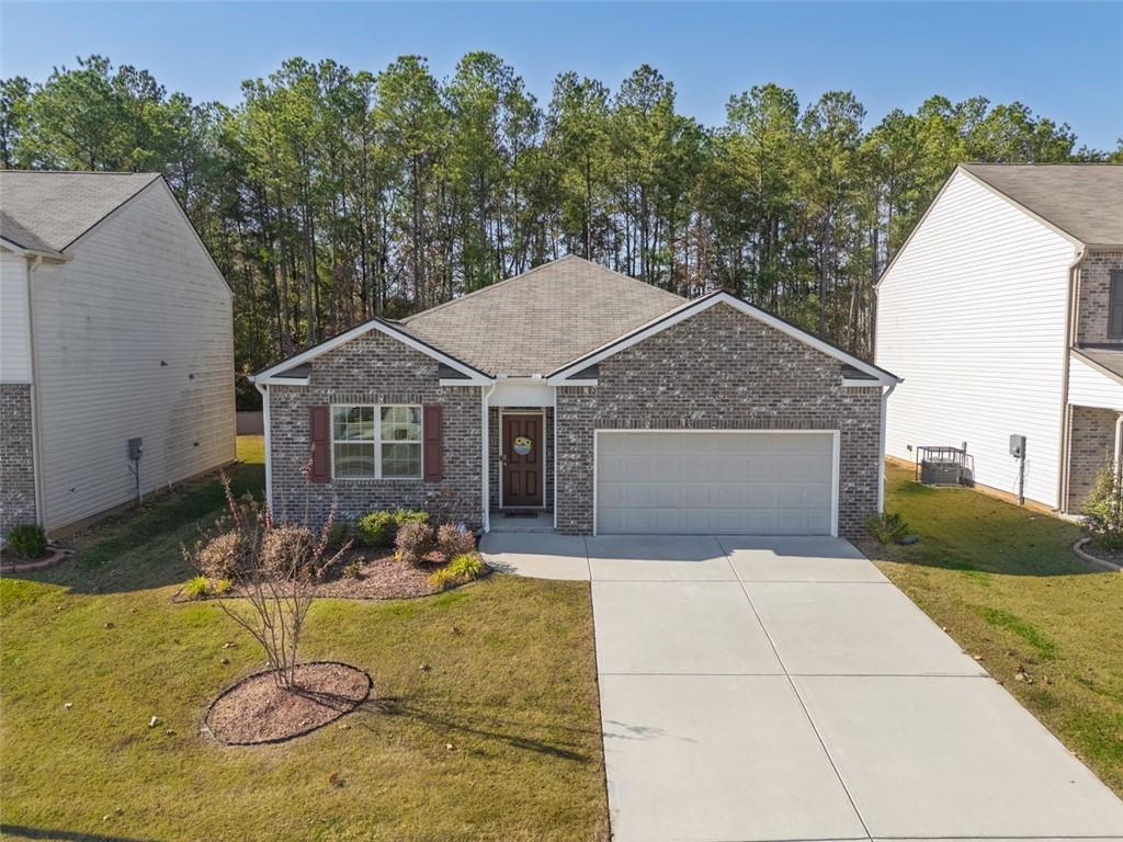 3841 Makeover Court Atlanta, GA 30349 - Photo 2 of 44 a view of backyard of the house