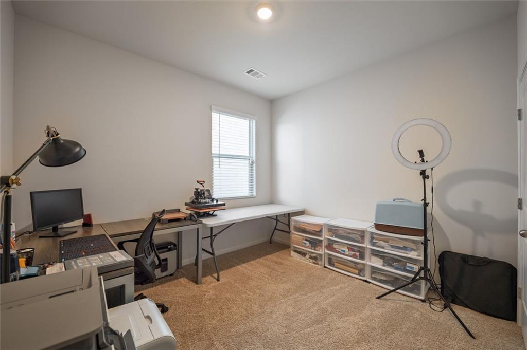 3841 Makeover Court Atlanta, GA 30349 - Photo 21 of 44 a view of a workspace with furniture