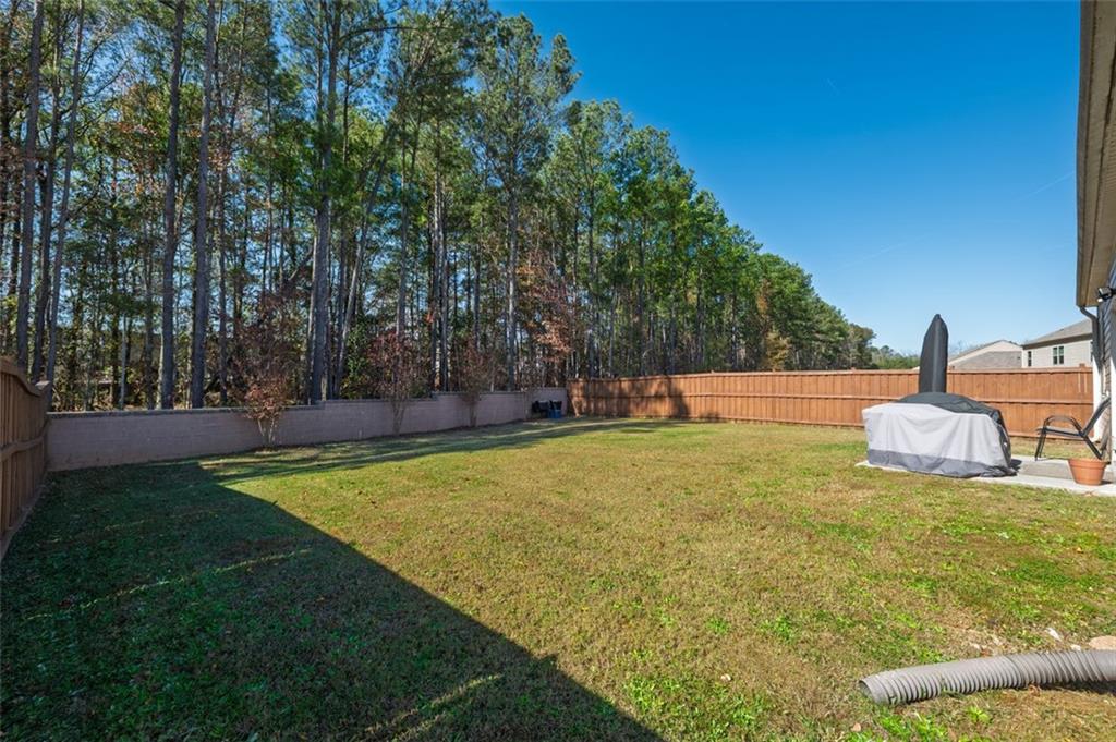 3841 Makeover Court Atlanta, GA 30349 - Photo 33 of 44 a view of yard with swimming pool and seating
