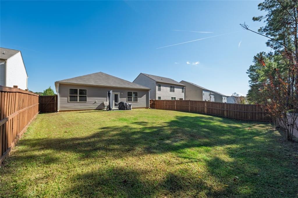 3841 Makeover Court Atlanta, GA 30349 - Photo 35 of 44 a house view with a swimming pool