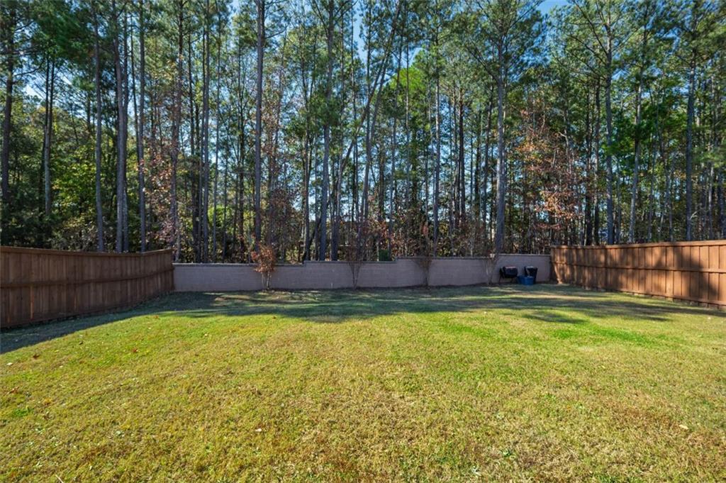 3841 Makeover Court Atlanta, GA 30349 - Photo 37 of 44 a view of swimming pool with an outdoor seating and a yard