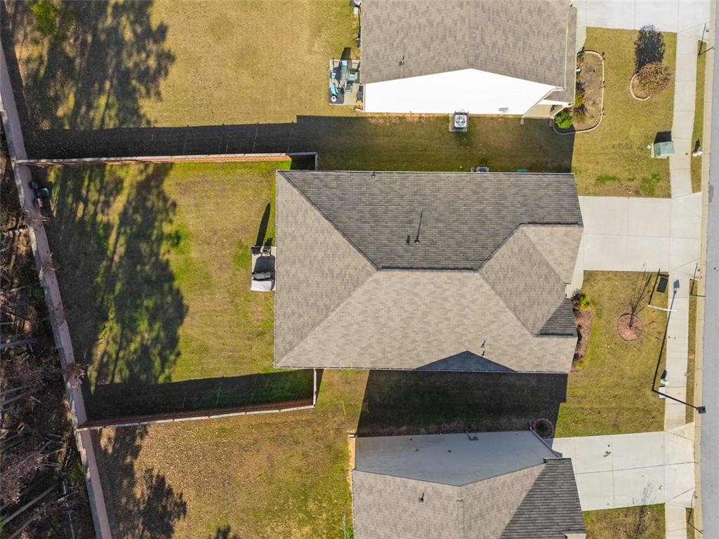 3841 Makeover Court Atlanta, GA 30349 - Photo 40 of 44 an aerial view of residential houses with outdoor space