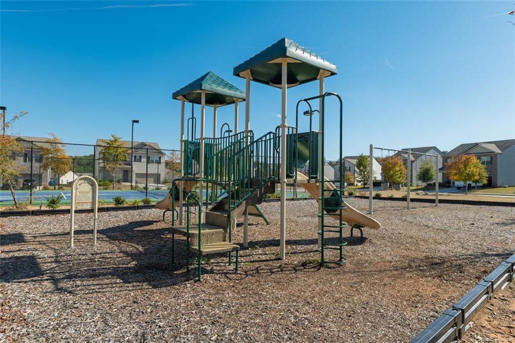 3841 Makeover Court Atlanta, GA 30349 - Photo 41 of 44 a view of a house with a porch