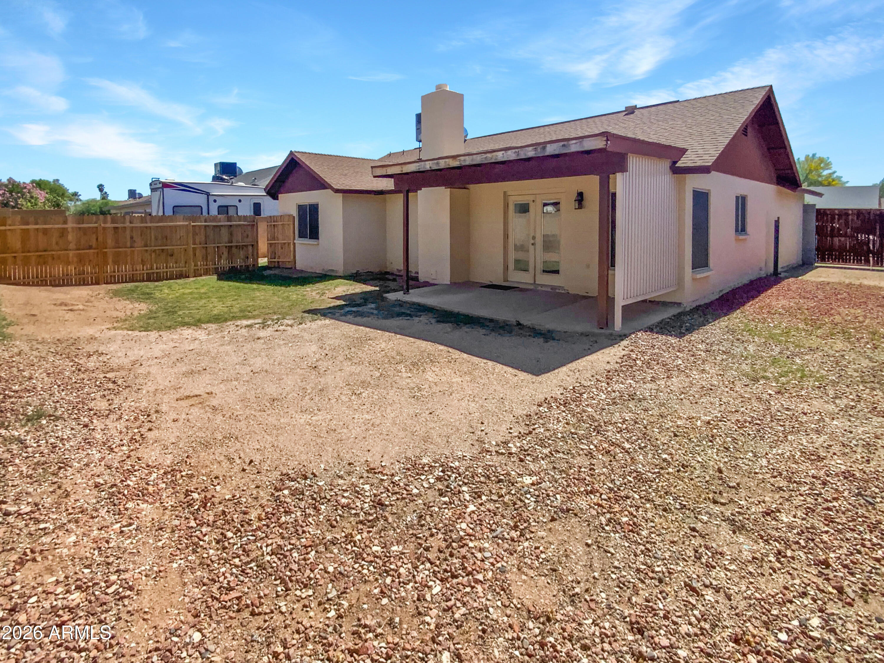 8508 West Ruth Avenue Peoria, AZ 85345 - Photo 5 of 17 a view of a house with a yard