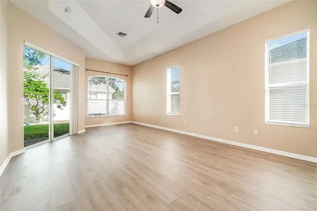 wooden floor in an empty room with a window