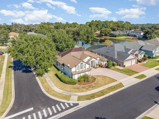 an aerial view of residential houses with outdoor space