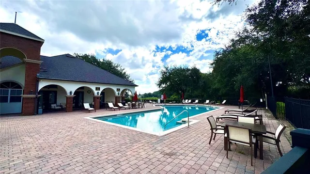 a view of chairs and tables in the patio