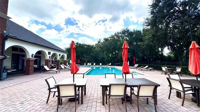 a view of a swimming pool with a lounge chairs