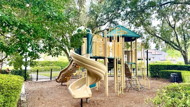 a view of a chairs and tables in the backyard