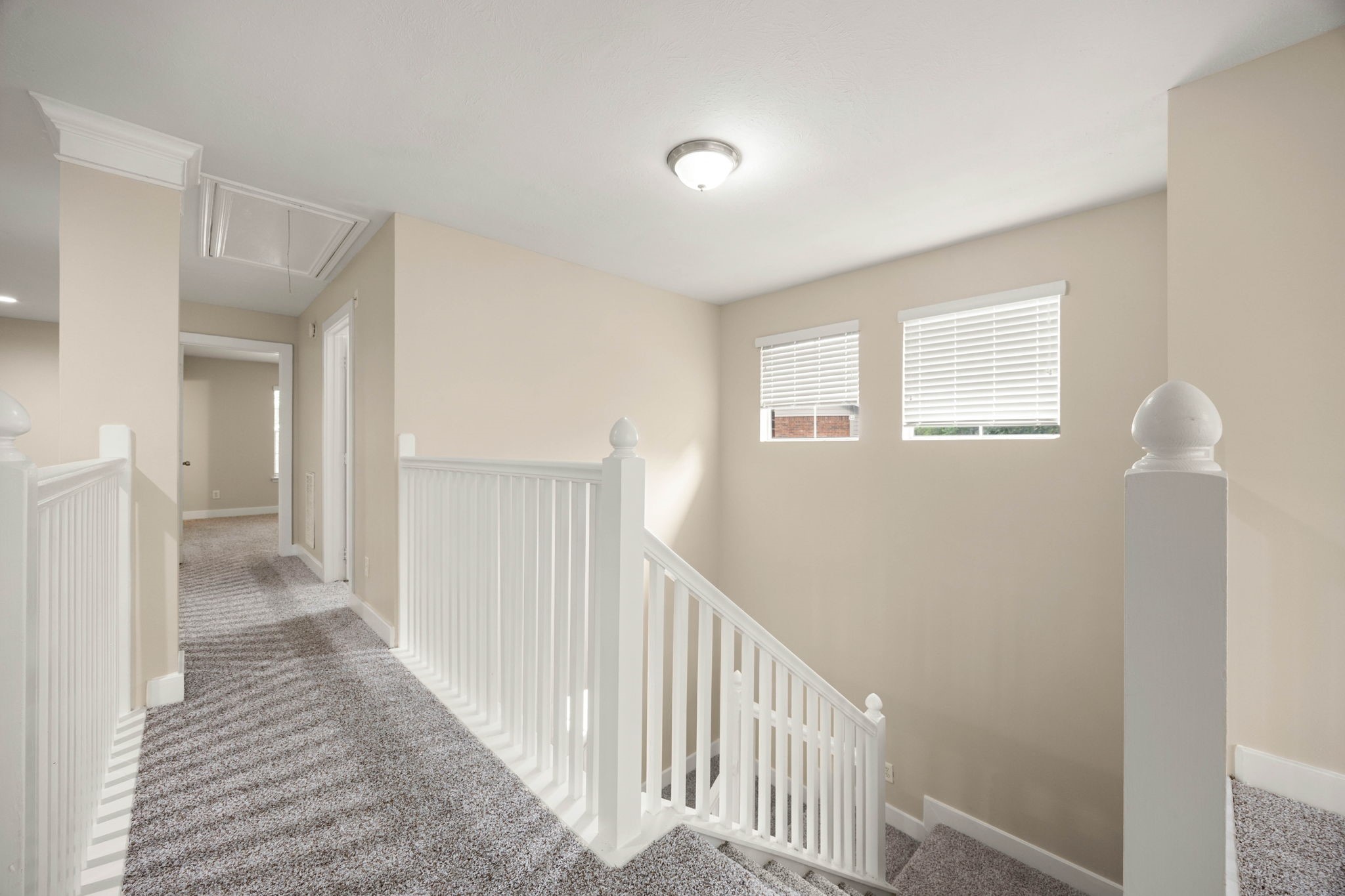 6335 Borg Breakpoint Drive Spring, TX 77379 - Photo 20 of 39 Upper-level landing with open railing and natural light.