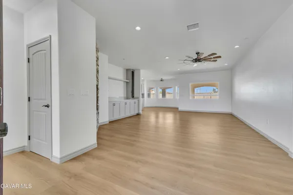 a view of a livingroom with wooden floor