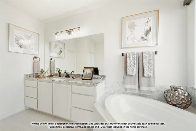 a bathroom with a tub a sink and mirror
