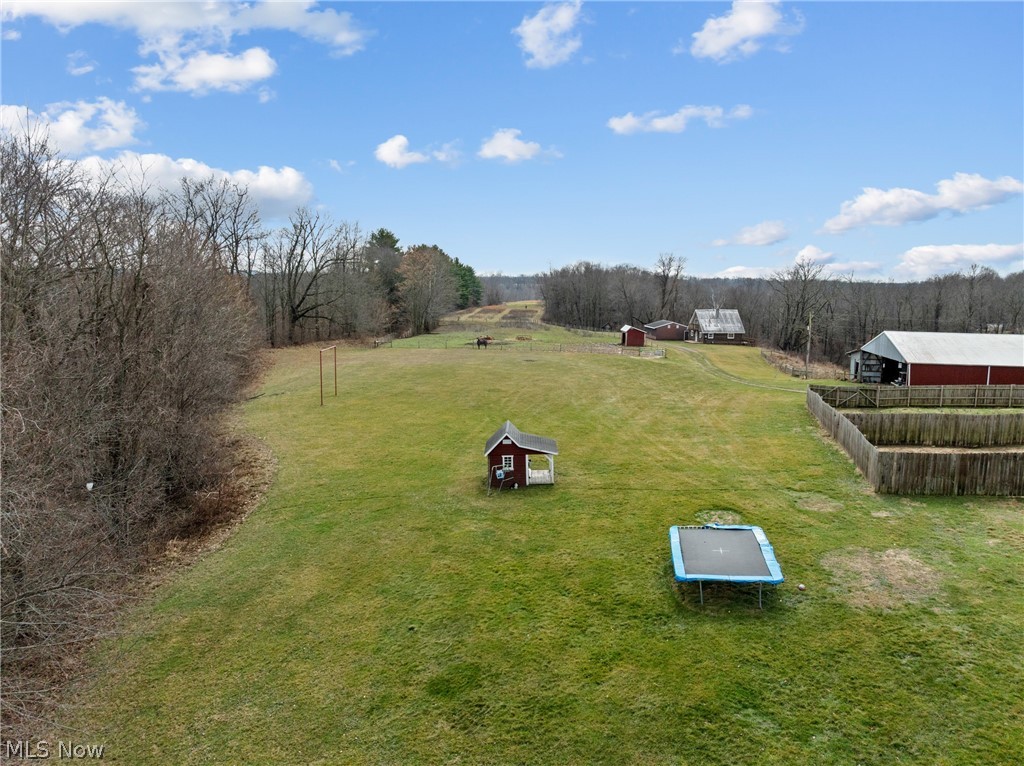 64508 Slade Road Cambridge, OH 43725 - Photo 42 of 50 View of yard with a view of countryside and a storage shed