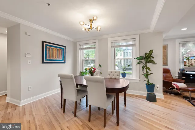 a view of a dining room with furniture window and wooden floor