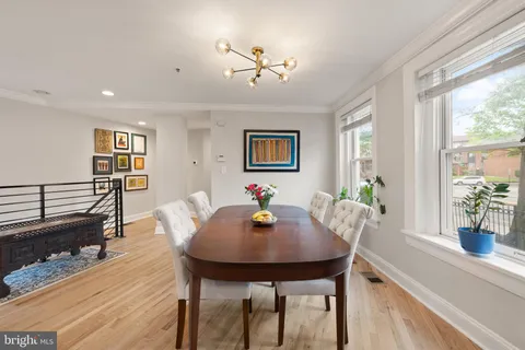 a living room with furniture rug and window