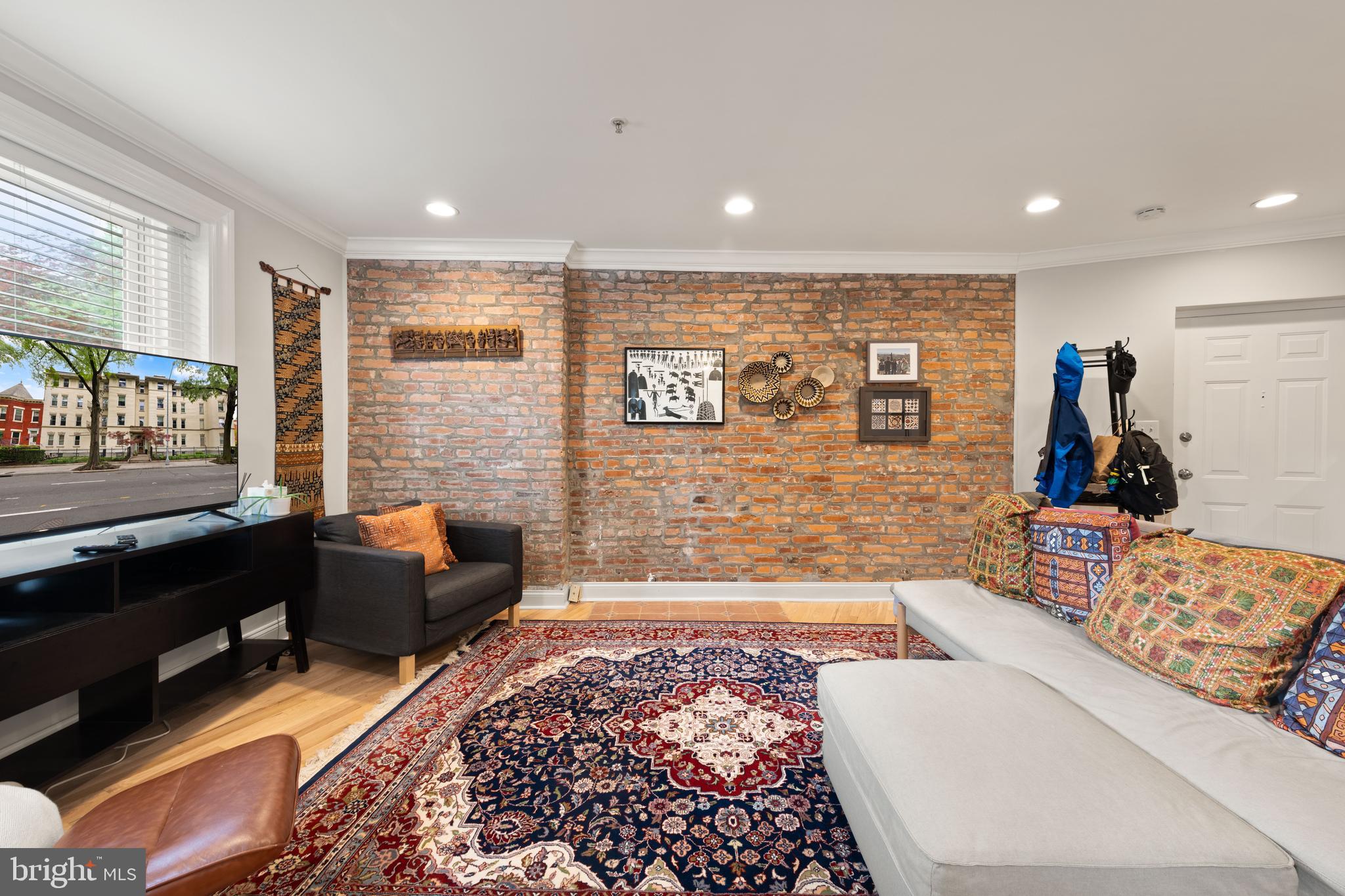 150 Rhode Island Avenue Northwest, Unit 103 Washington, DC 20001 - Photo 15 of 30 a living room with furniture rug and window