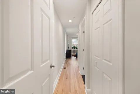 a bedroom with a bed window and table