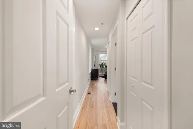 a bedroom with a bed window and table