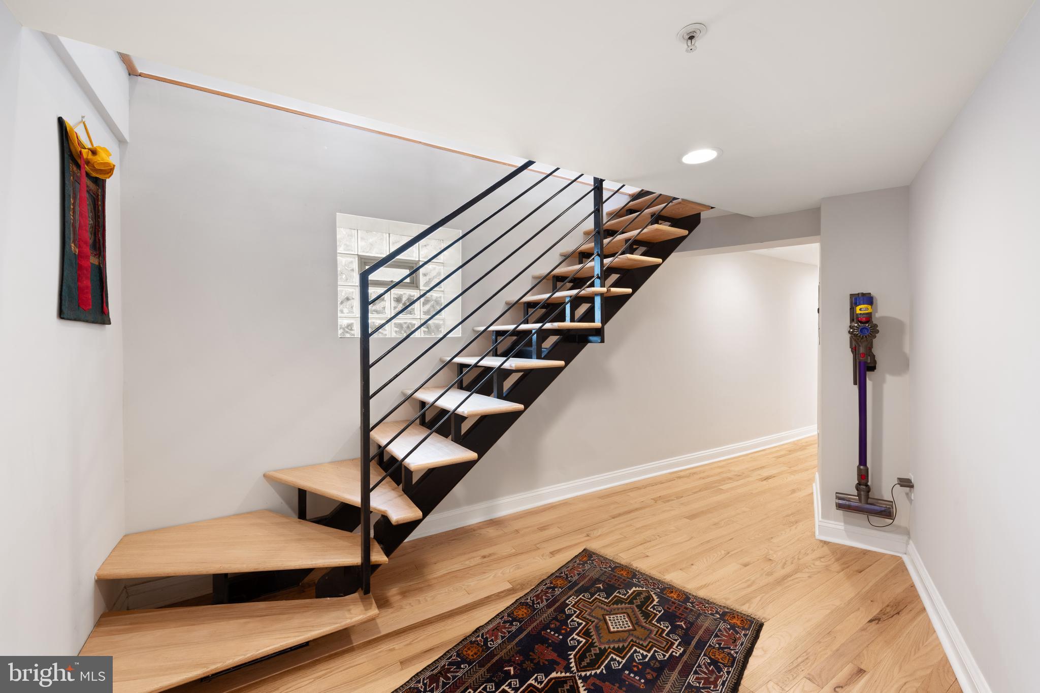 150 Rhode Island Avenue Northwest, Unit 103 Washington, DC 20001 - Photo 24 of 30 a view of entryway bedroom and hall with wooden floor