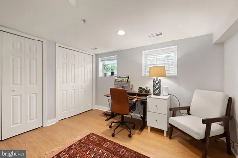 a workspace with furniture and a book shelf