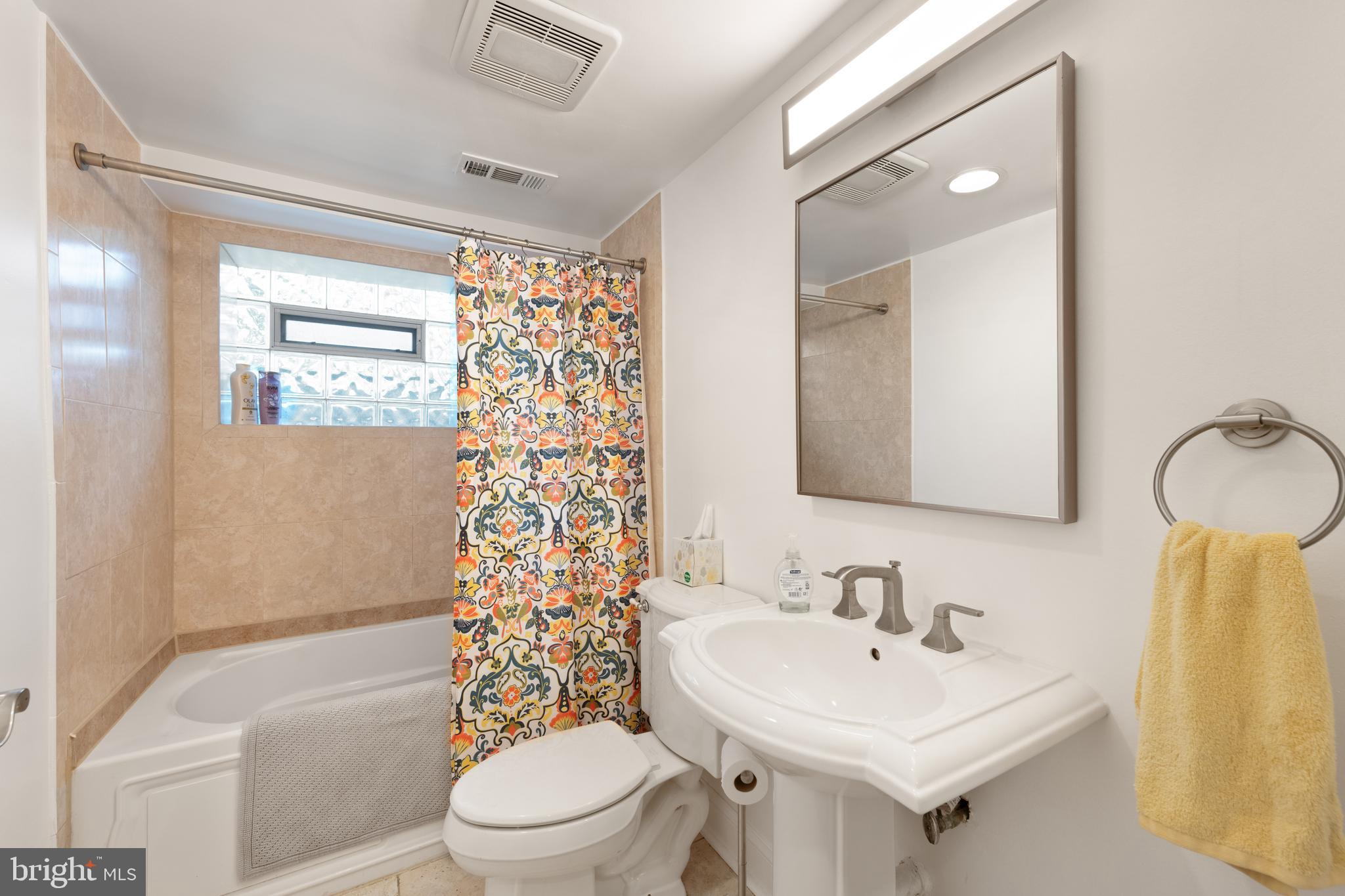 150 Rhode Island Avenue Northwest, Unit 103 Washington, DC 20001 - Photo 27 of 30 a bathroom with a sink toilet and shower