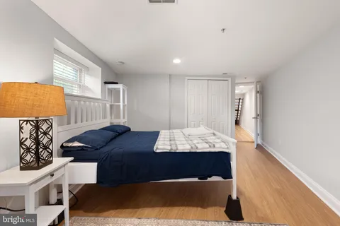 a view of a bedroom with washer and dryer
