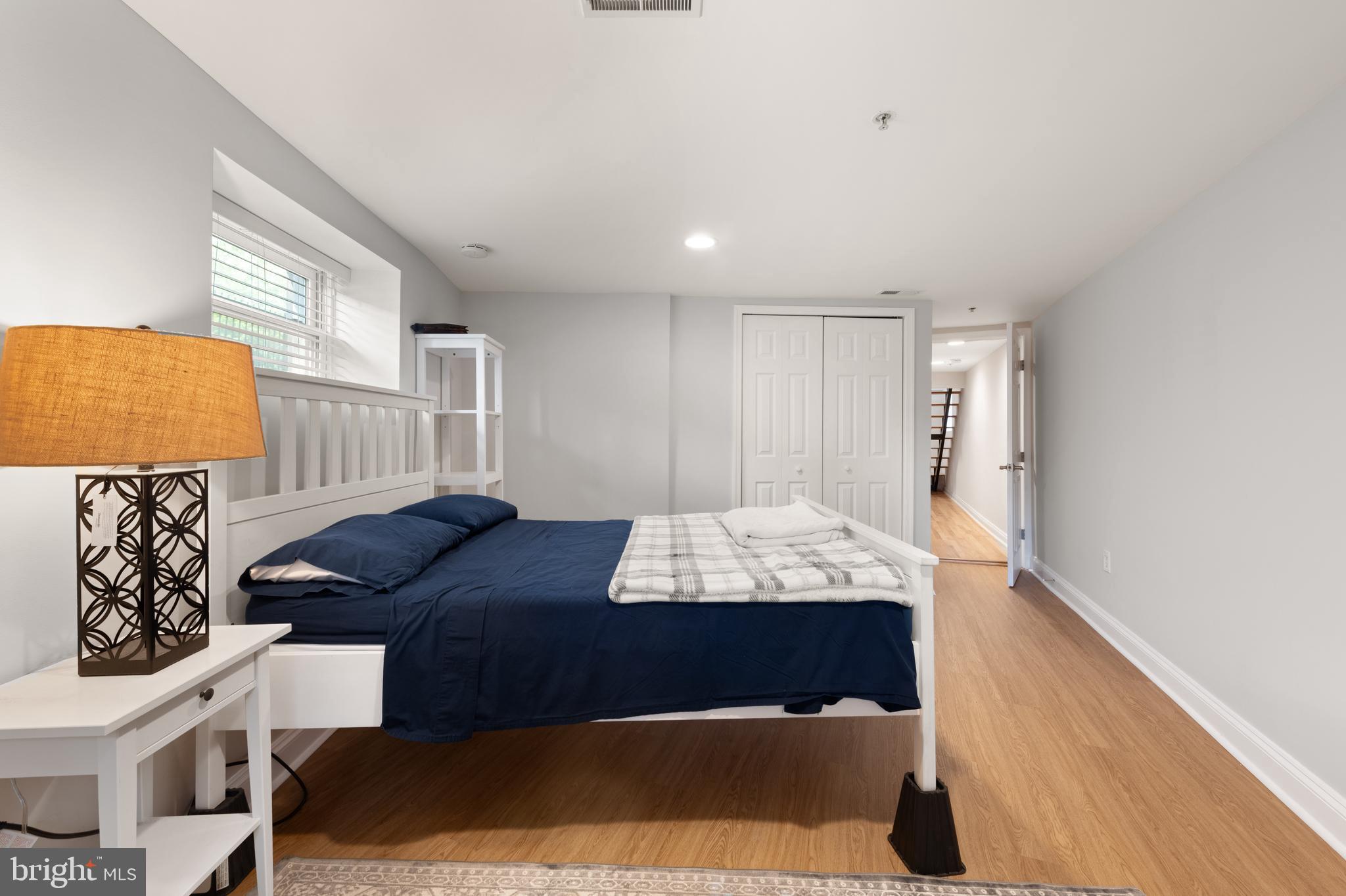 150 Rhode Island Avenue Northwest, Unit 103 Washington, DC 20001 - Photo 29 of 30 a bedroom with a bed and a window