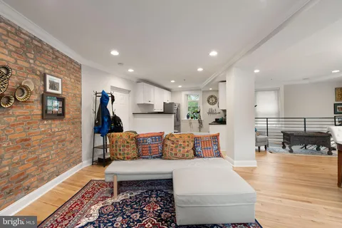 a kitchen with stainless steel appliances granite countertop a refrigerator a stove and a sink