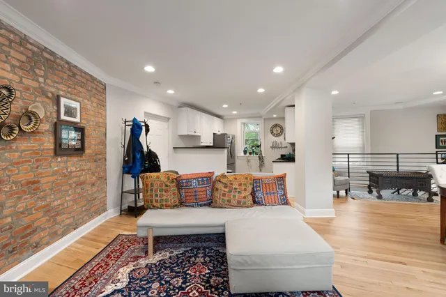 a kitchen with stainless steel appliances granite countertop a refrigerator a stove and a sink