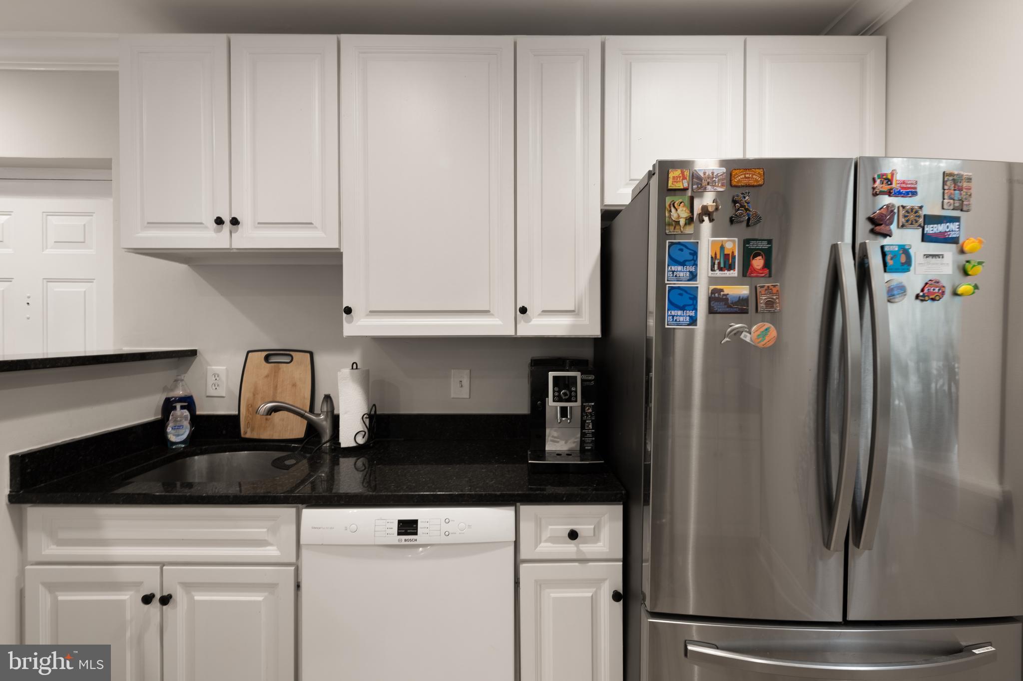 150 Rhode Island Avenue Northwest, Unit 103 Washington, DC 20001 - Photo 6 of 30 a kitchen with stainless steel appliances granite countertop a refrigerator a stove and a sink