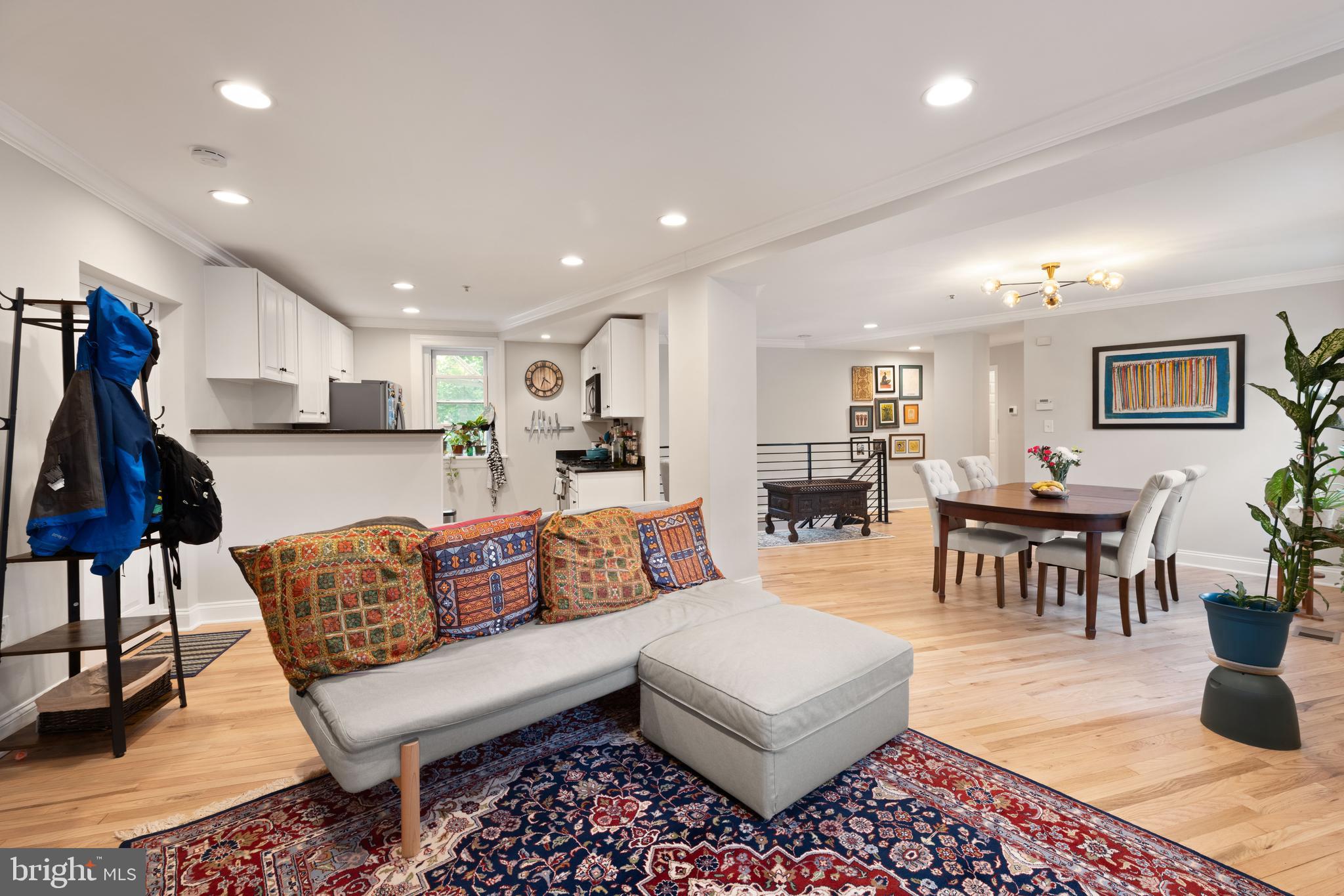 150 Rhode Island Avenue Northwest, Unit 103 Washington, DC 20001 - Photo 9 of 30 a living room with furniture kitchen view and a dining table