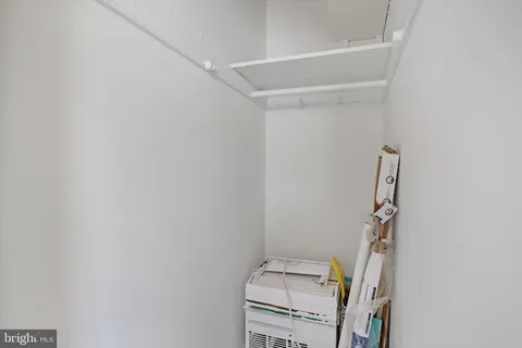 a view of storage and utility room with empty racks