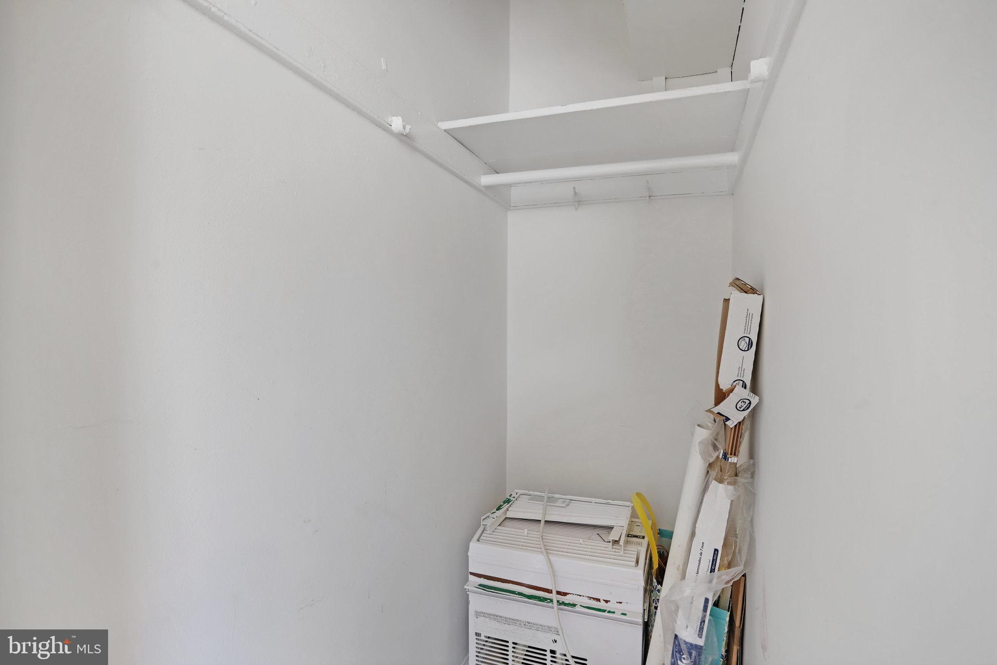 1446 Tuckerman Street Northwest, Unit 306 Washington, DC 20011 - Photo 17 of 26 a view of storage and utility room with empty racks