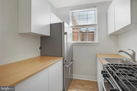 a kitchen with a stove and a refrigerator
